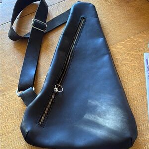 Black Crossbody Bag with Unique Shape and Adjustable Strap